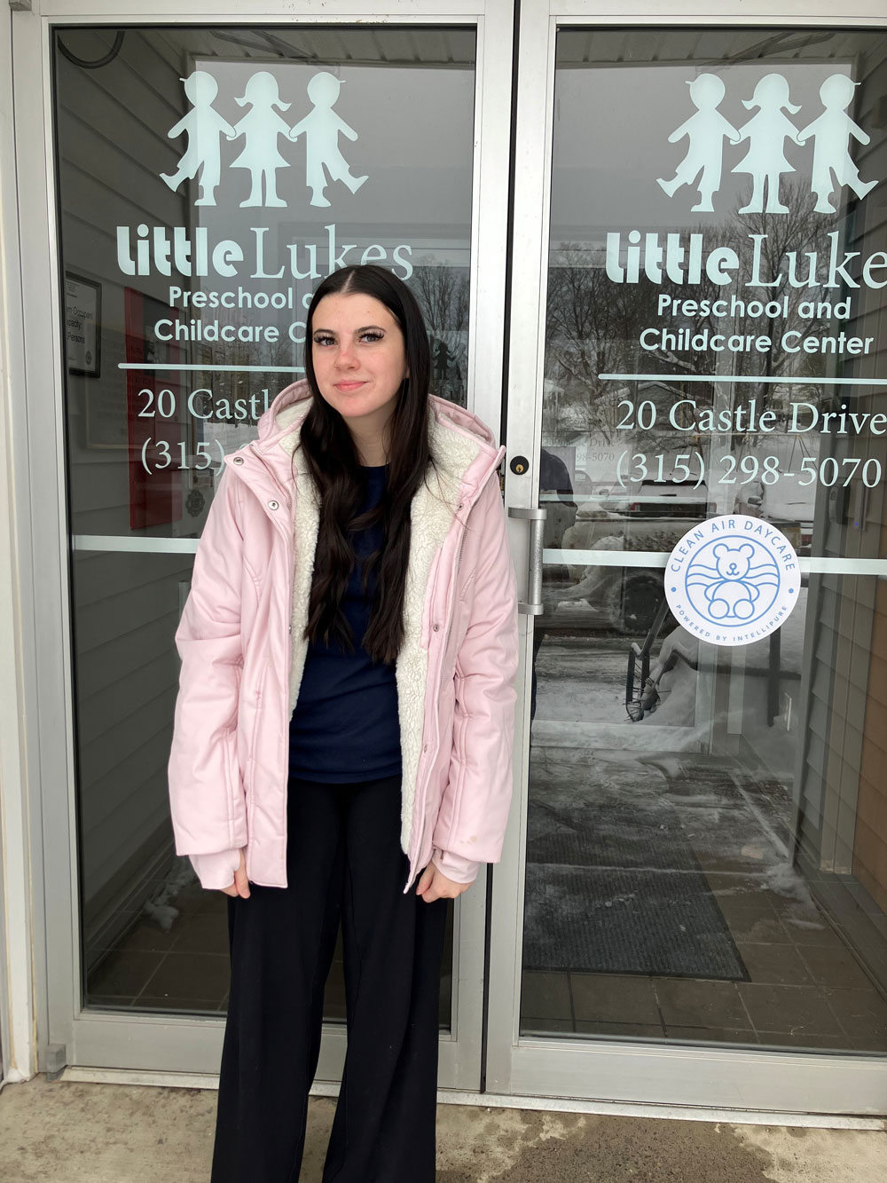 Carrie Pruett standing in front of Little Lukes Daycare