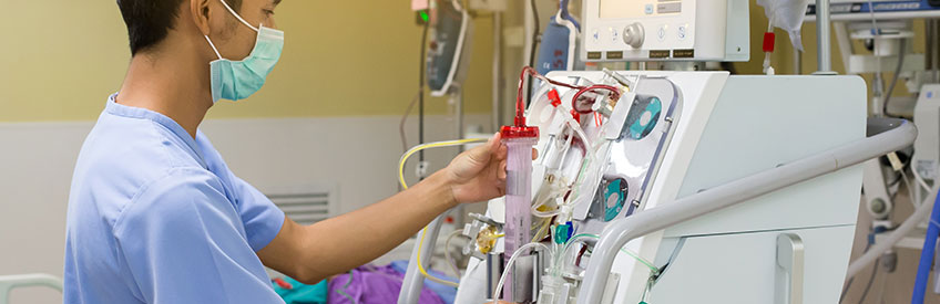 Nurse with Dialysis Machine