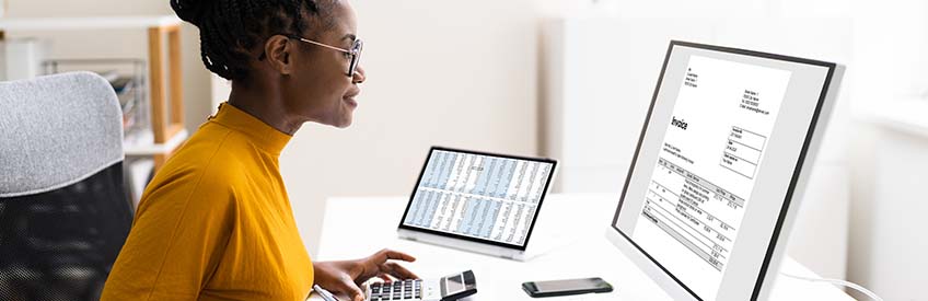 Accountant with computer and calculator