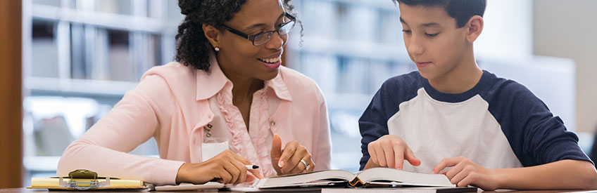 Tutor working with middle school student