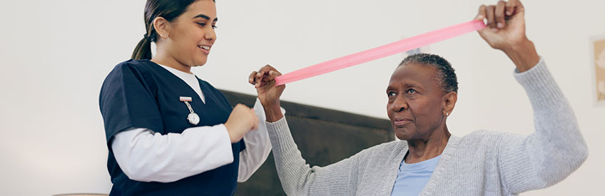 Healthcare Professionals Assisting a Patient at a Reception Desk