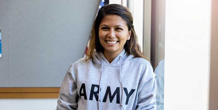 Veteran in ARMY hoodie smiling