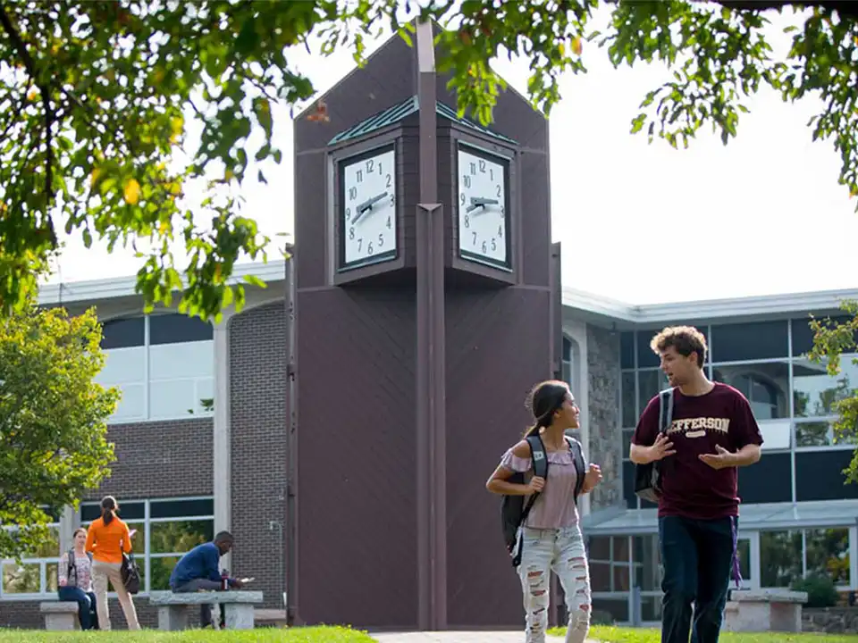 Students walking in front of campus clock tower