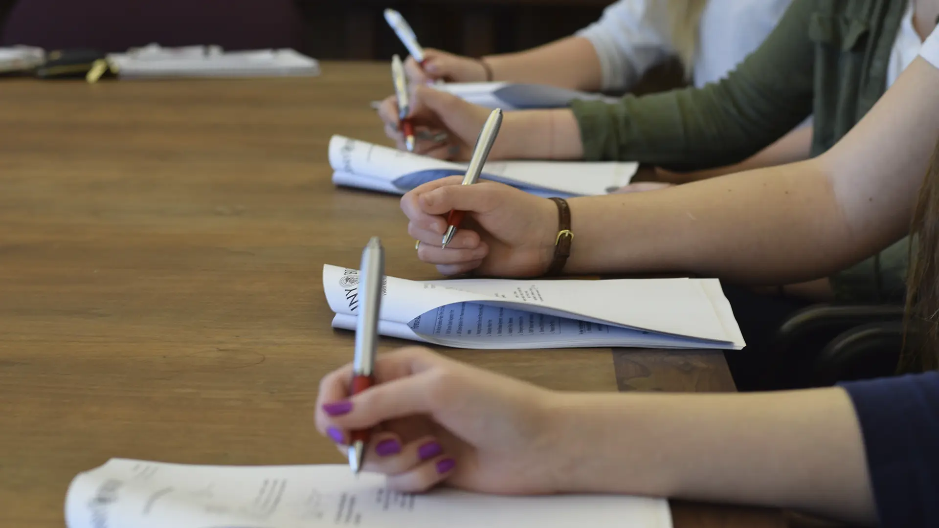 Group of students signing scholarship