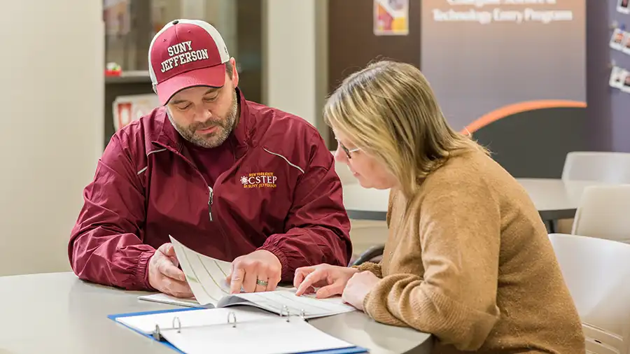 Student and JCC staff preparing documents