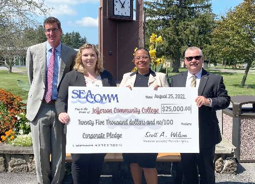 Image of group holding big check