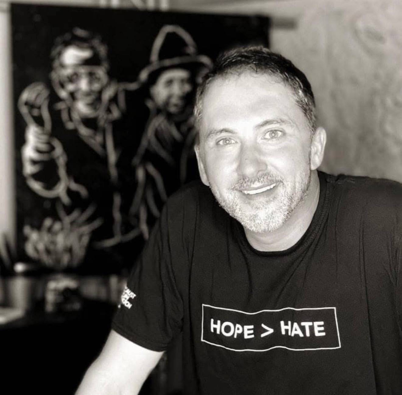 Black and white photo of keynote speaker and speed painter Tom Varano