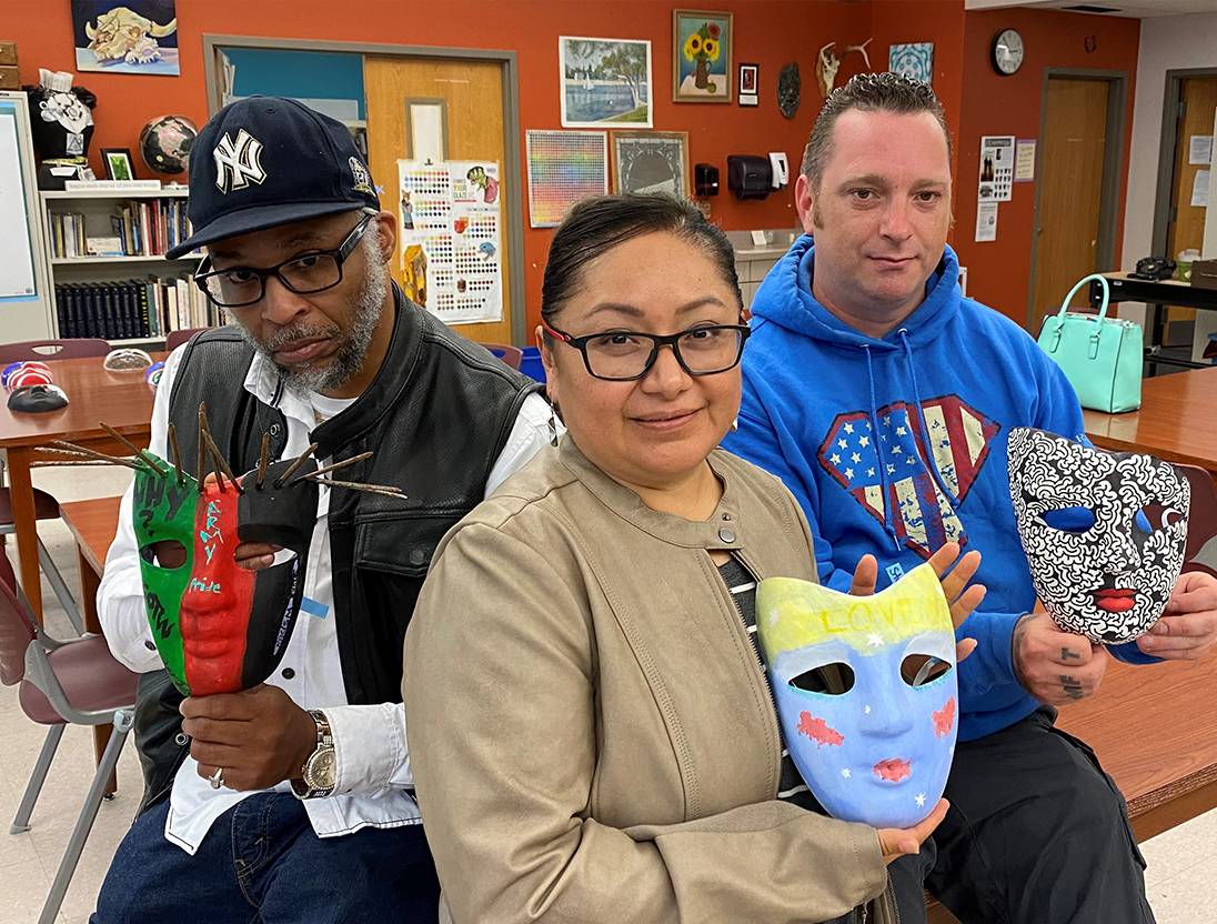 Image of Veteran Students Holding Masks