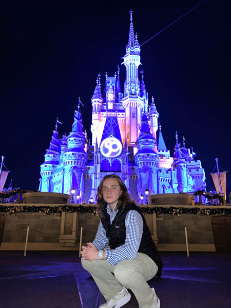 Intern in front of Disney Castle
